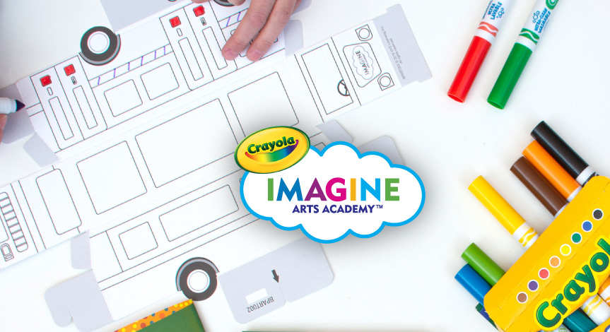 A kid coloring on a Crayola Imagine Arts academy take home train. In the middle of the train there is a Crayola Imagine arts 